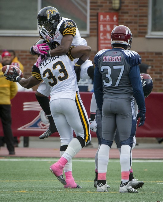 Hamilton Tiger-Cats Frederic Plesius celebrates his 2nd quarter touchdown with his team mate during 11st half CFL action in Montreal on Sunday October 18, 2015 (CFL PHOTO - Peter McCabe)