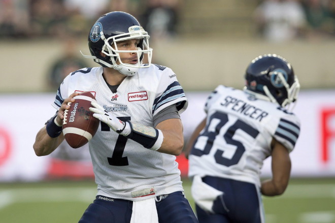 Toronto Argonauts quarterback Trevor Harris (7) looks for the open receiver against the Edmonton Eskimos during first half action in Edmonton, Alta., on Friday August 28, 2015. THE CANADIAN PRESS/Jason Franson.