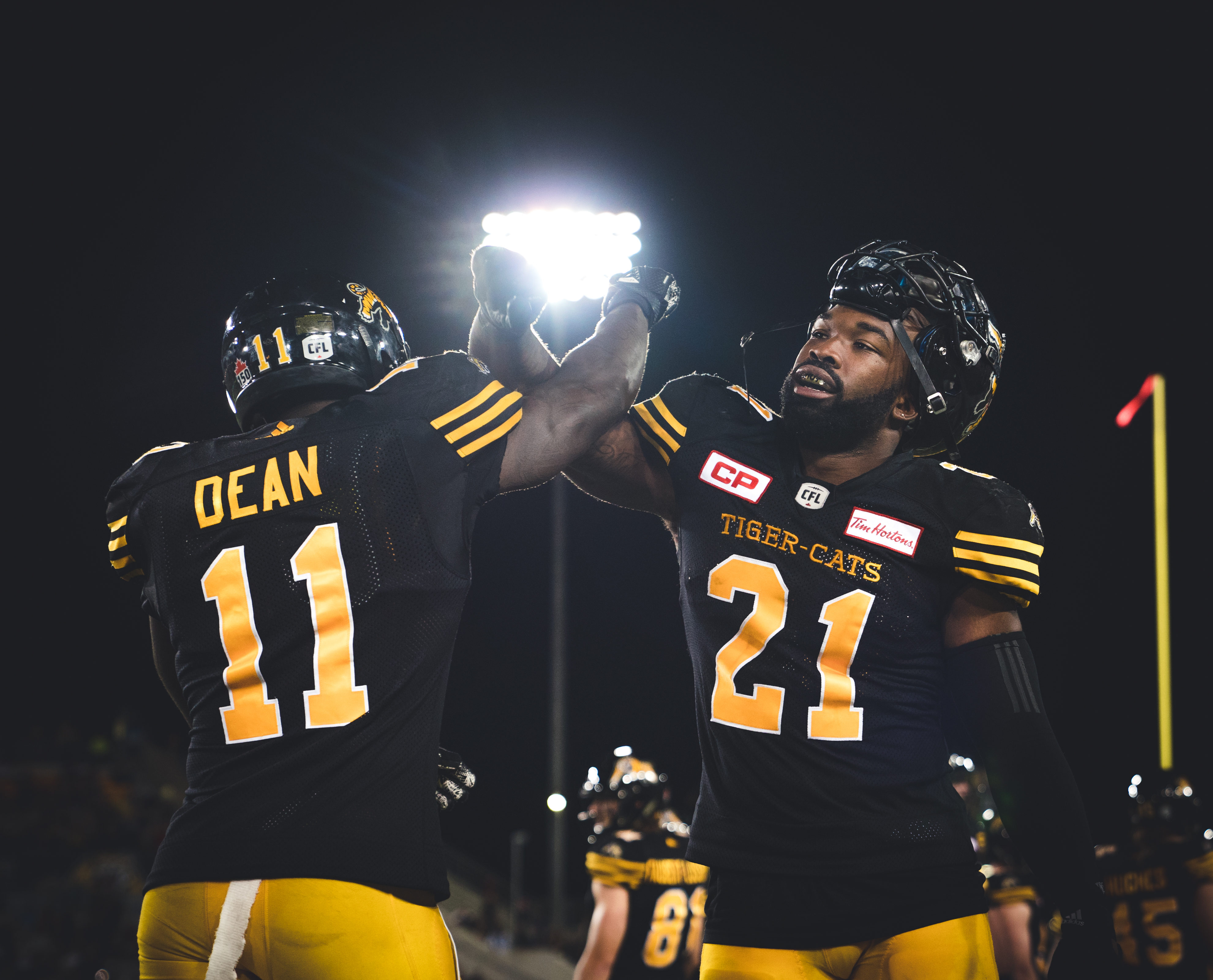Simoni Lawrence (21) and Larry Dean (11) of the Hamilton Tiger-Cats during the game against the Ottawa RedBlacks at Tim Horton's Field in Hamilton, ON, Friday, August 18, 2017. (Photo: Johany Jutras)